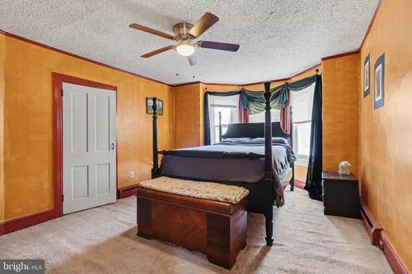 a view of an empty room with a wooden door