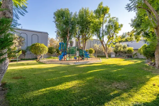 a swimming pool with outdoor seating and yard