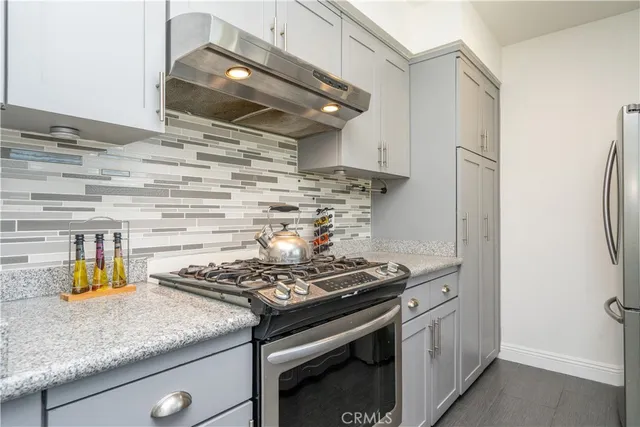 a kitchen with a stove and a cabinet