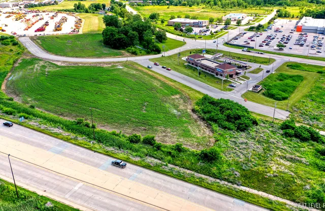 a view of a table and chairs in a garden