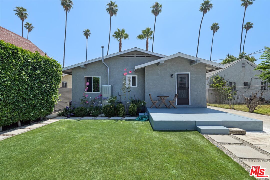 3447 9th Avenue Los Angeles, CA 90018 - Photo 14 of 18 a front view of a house with a yard