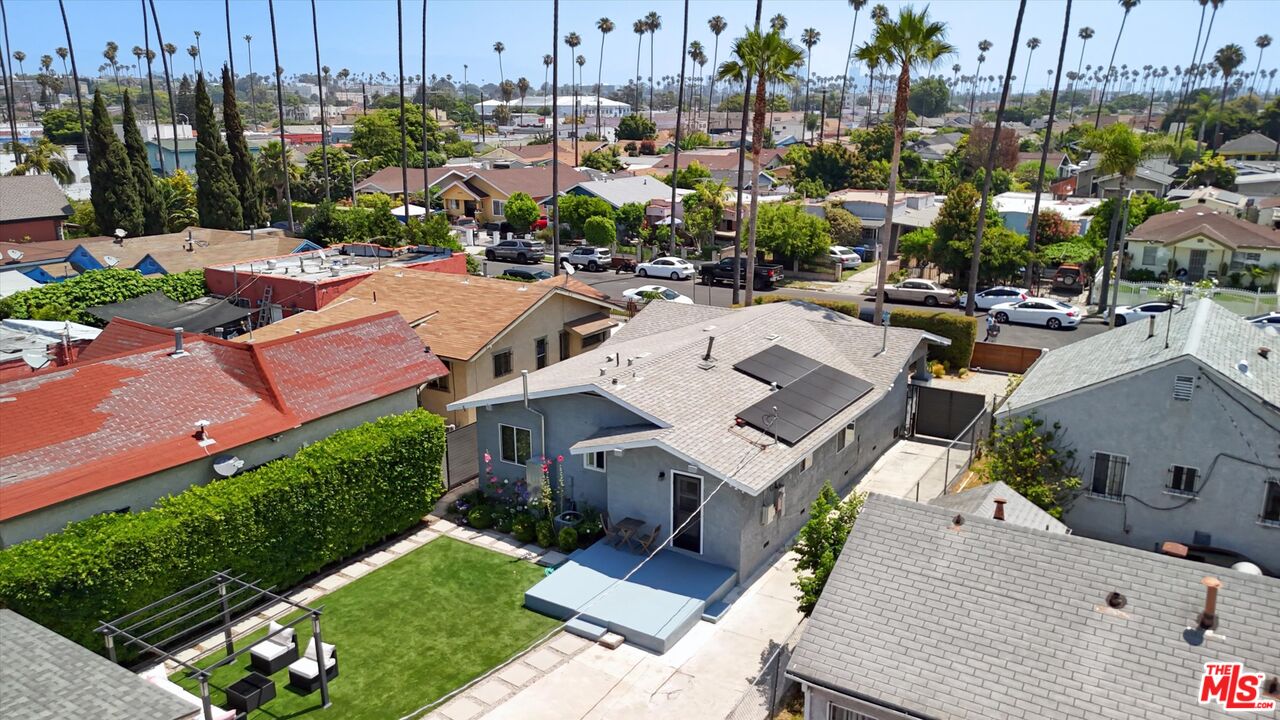 3447 9th Avenue Los Angeles, CA 90018 - Photo 16 of 18 a view of a house with a garden and sitting area