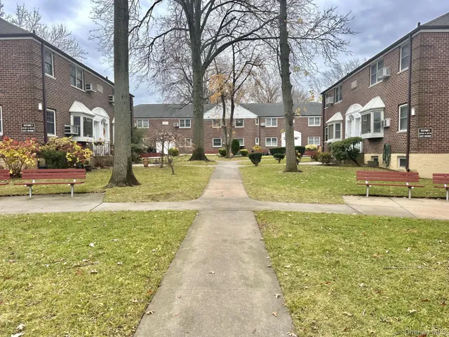 a view of a swimming pool with outdoor seating