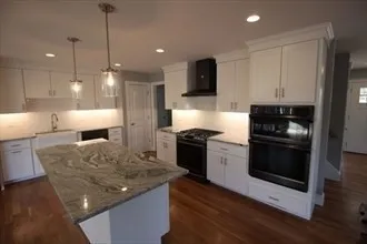 a kitchen with a stove and a refrigerator