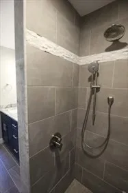 an empty room with wooden floor and fireplace