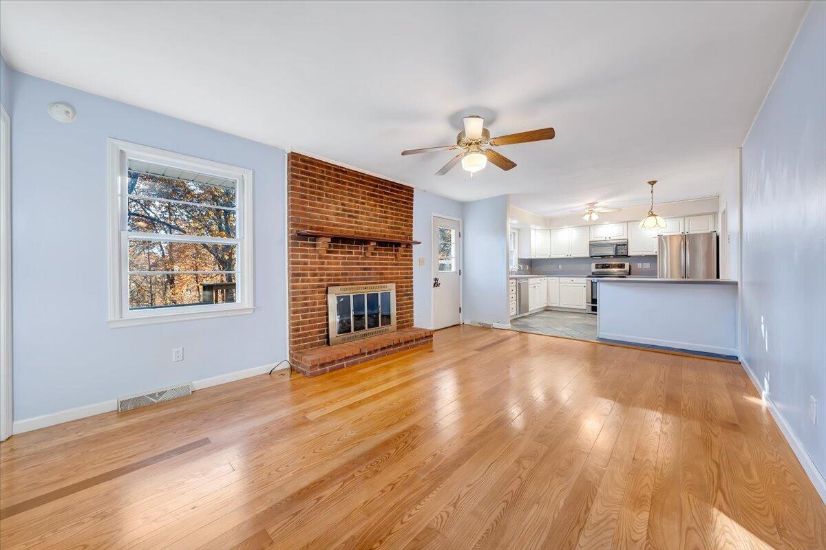 88 Persimmon Court Blue Ridge, VA 24064 - Photo 14 of 37 a view of empty room with wooden floor and fan