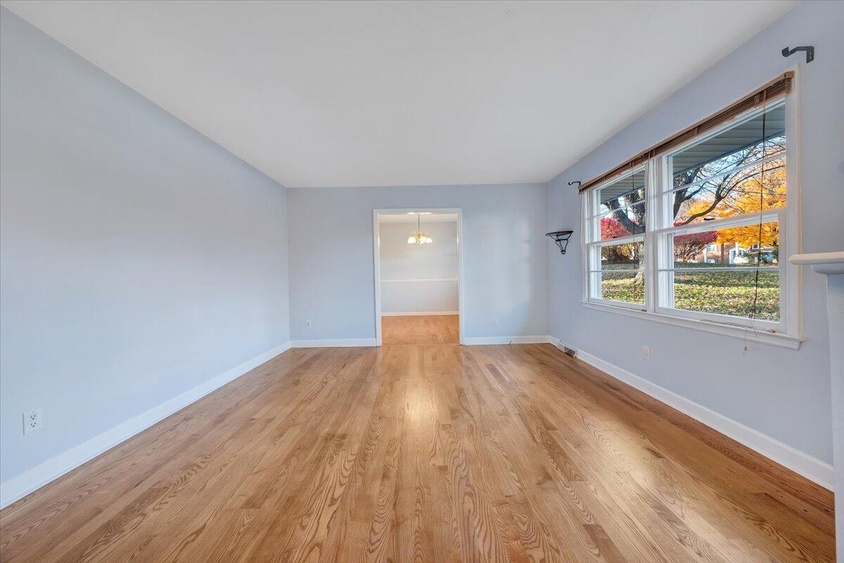 88 Persimmon Court Blue Ridge, VA 24064 - Photo 4 of 37 a view of empty room with wooden floor and fan