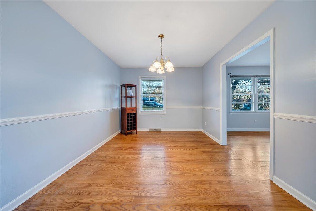 88 Persimmon Court Blue Ridge, VA 24064 - Photo 5 of 37 a view of an empty room with window and wooden floor