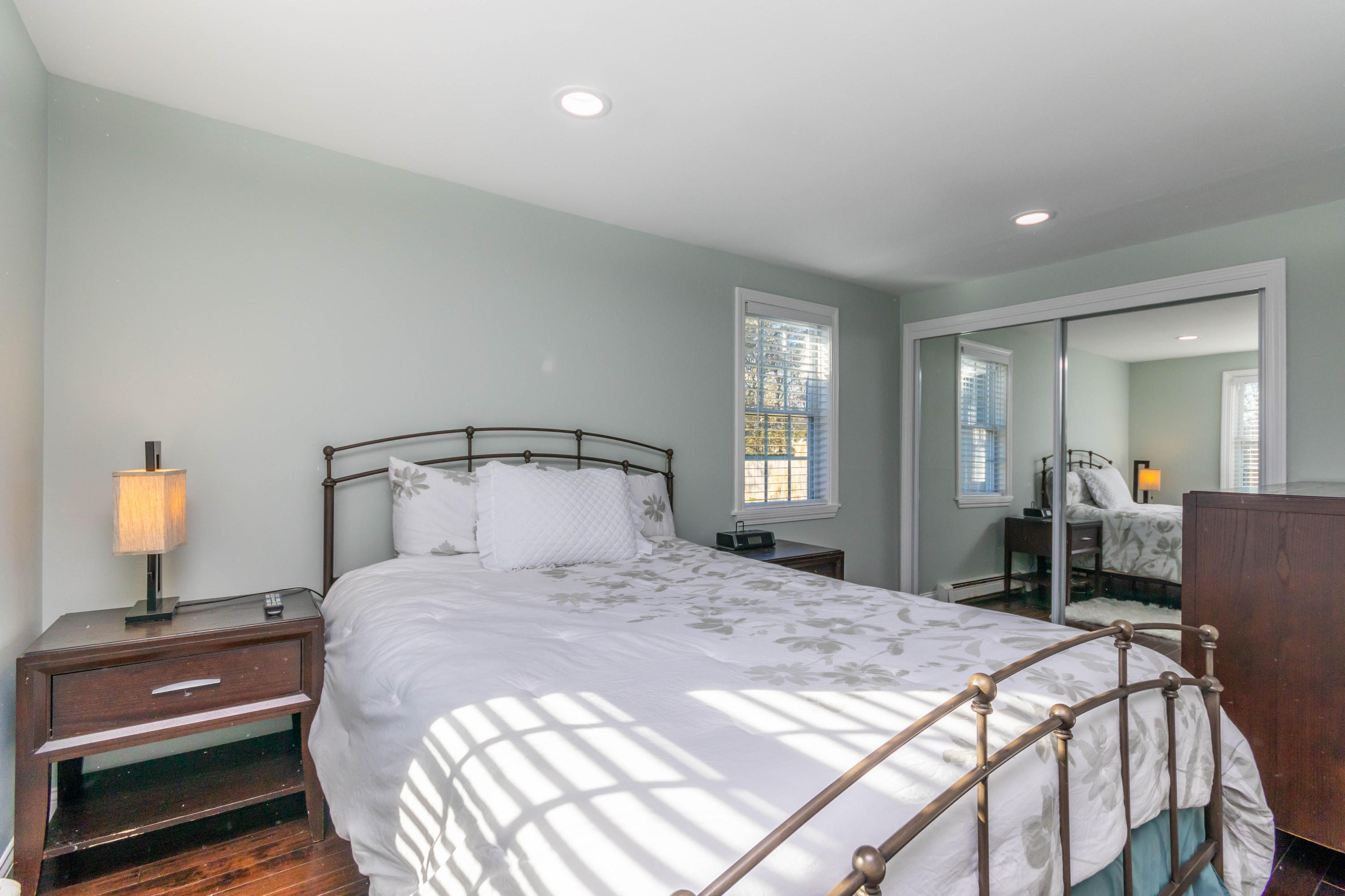 371 Megan Road Hyannis, MA 02601 - Photo 12 of 34 a bedroom with a bed and a lamp