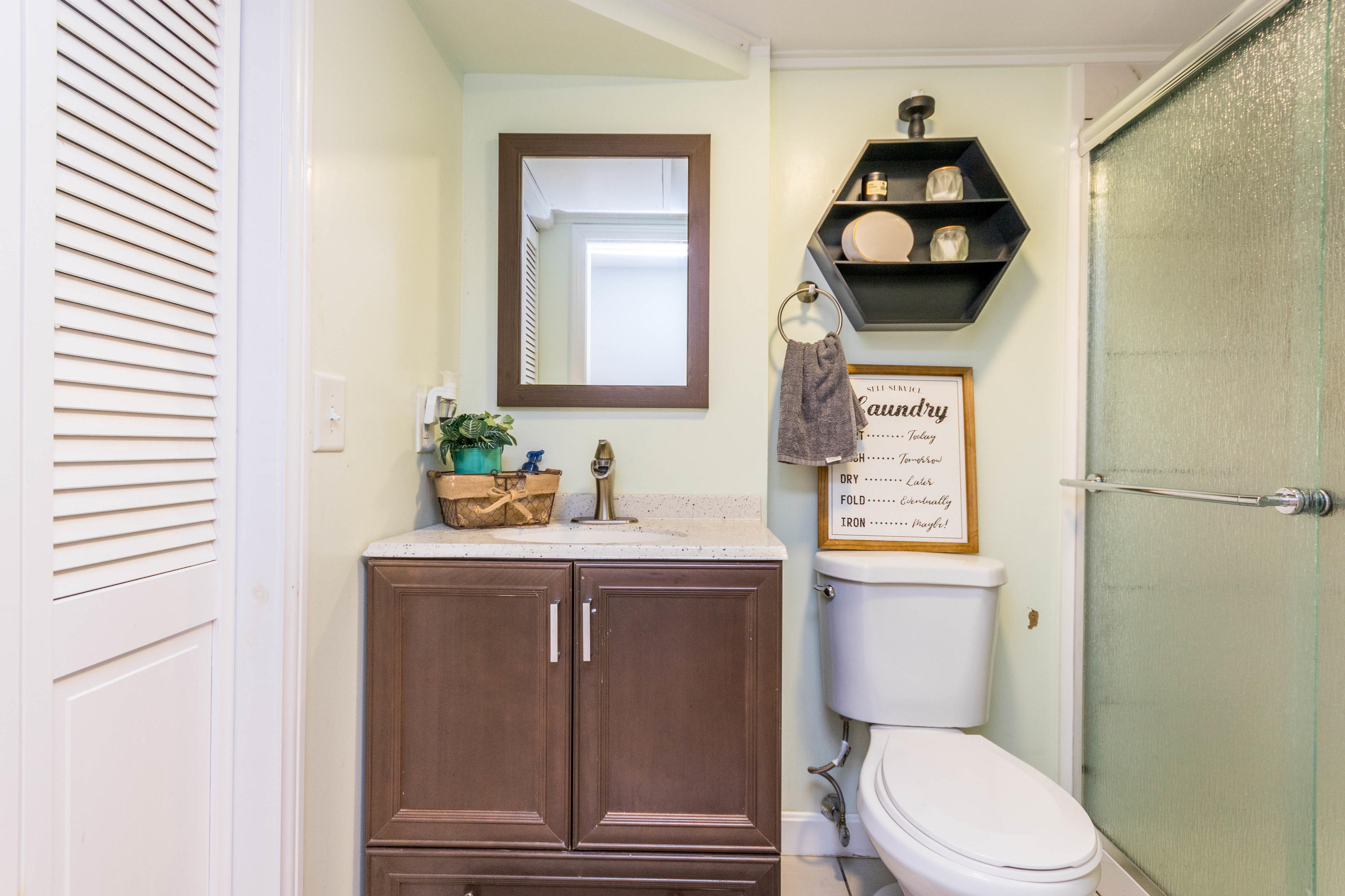 371 Megan Road Hyannis, MA 02601 - Photo 21 of 34 a bathroom with a toilet a sink and mirror