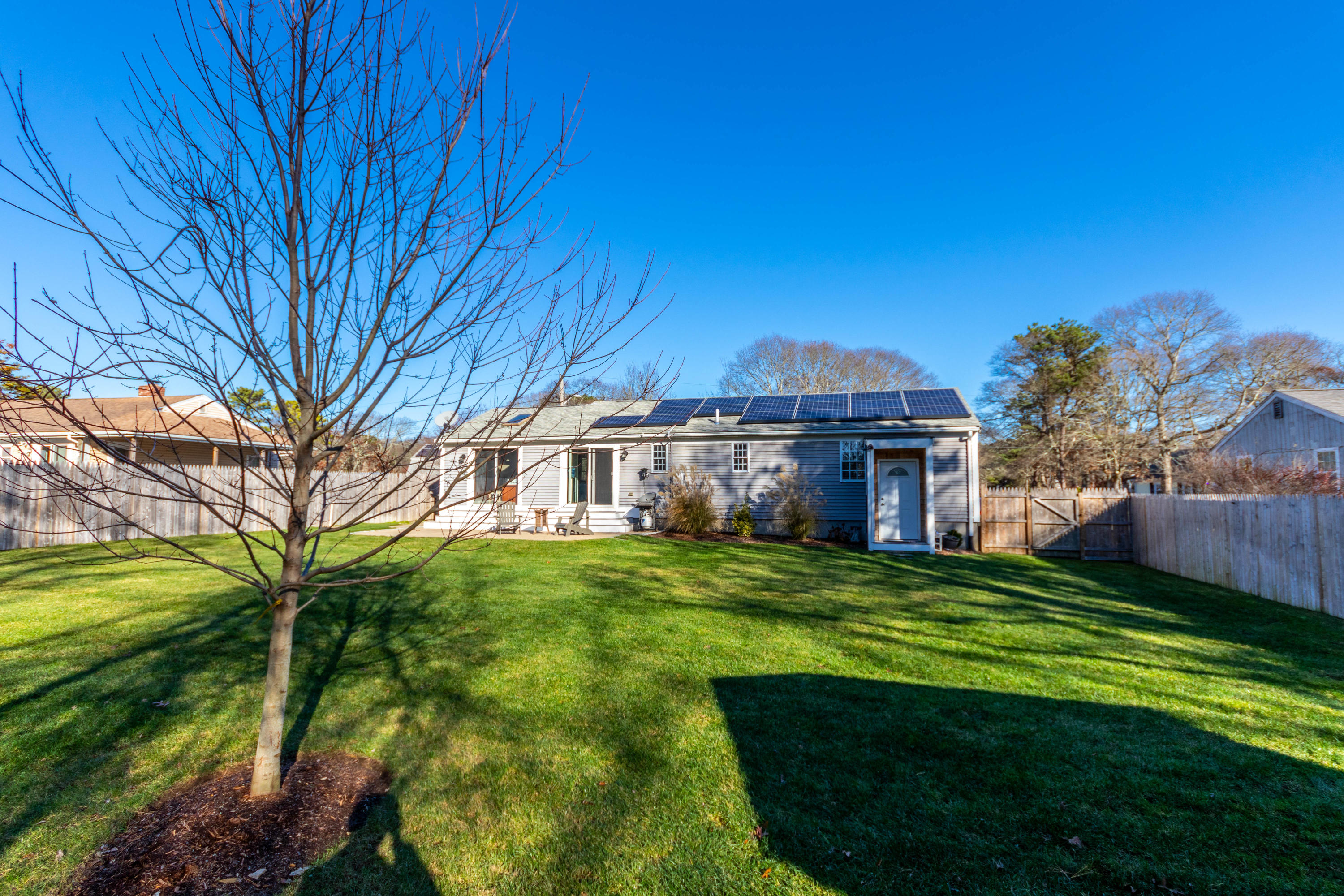 371 Megan Road Hyannis, MA 02601 - Photo 23 of 34 a view of a big house with a big yard plants and large trees