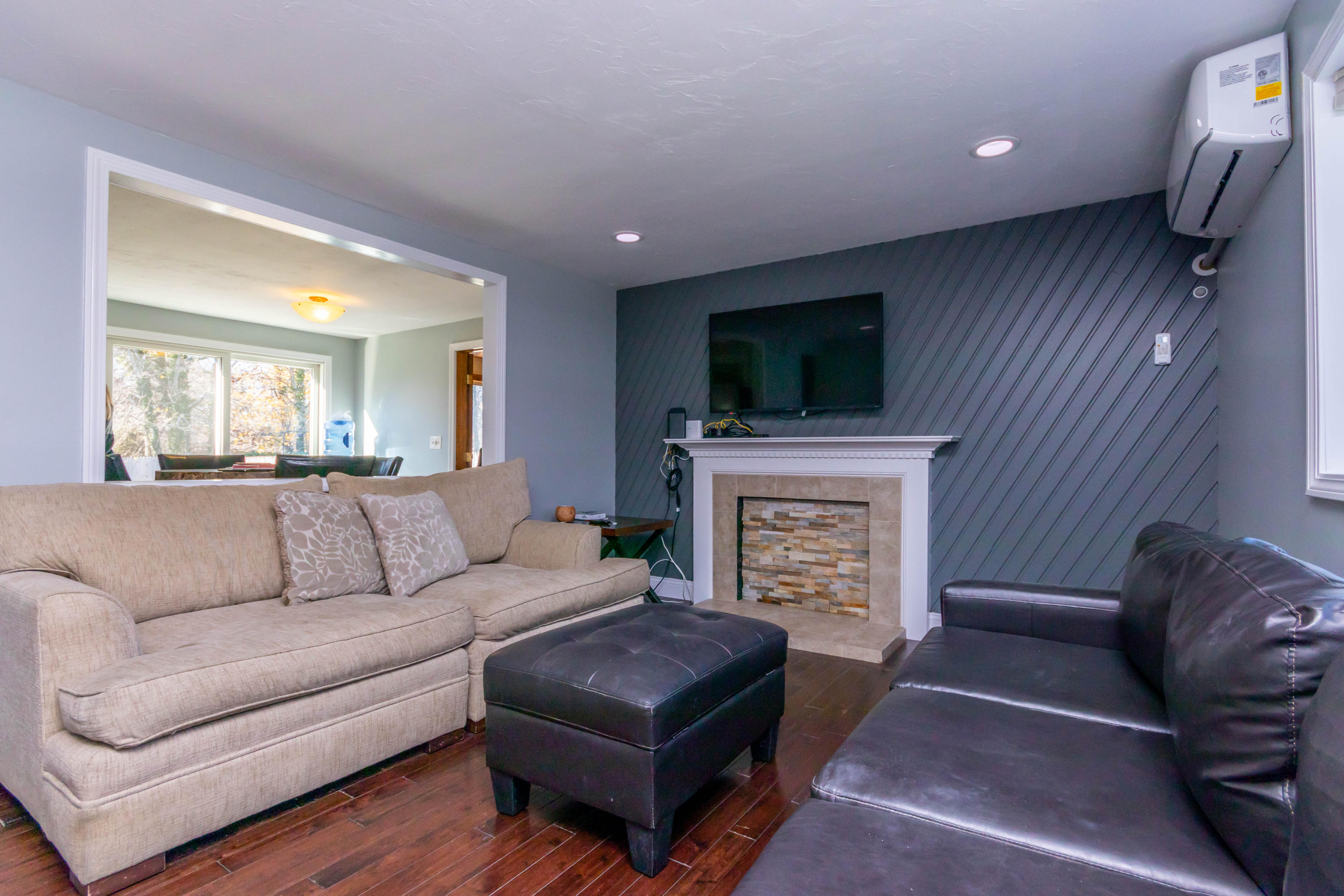 371 Megan Road Hyannis, MA 02601 - Photo 4 of 34 a living room with furniture a flat screen tv and a fireplace