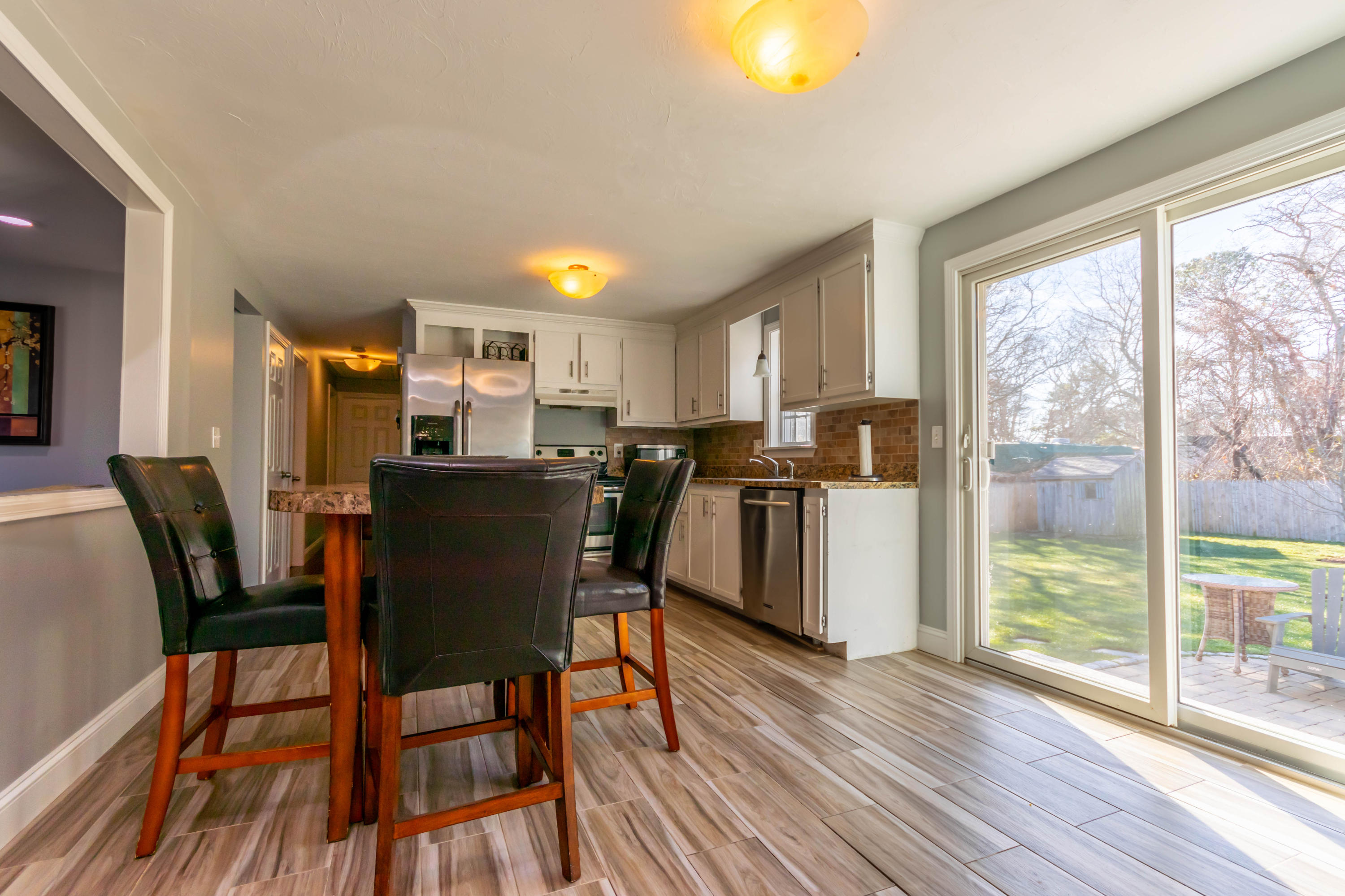 371 Megan Road Hyannis, MA 02601 - Photo 6 of 34 a view of a dining room with furniture and wooden floor