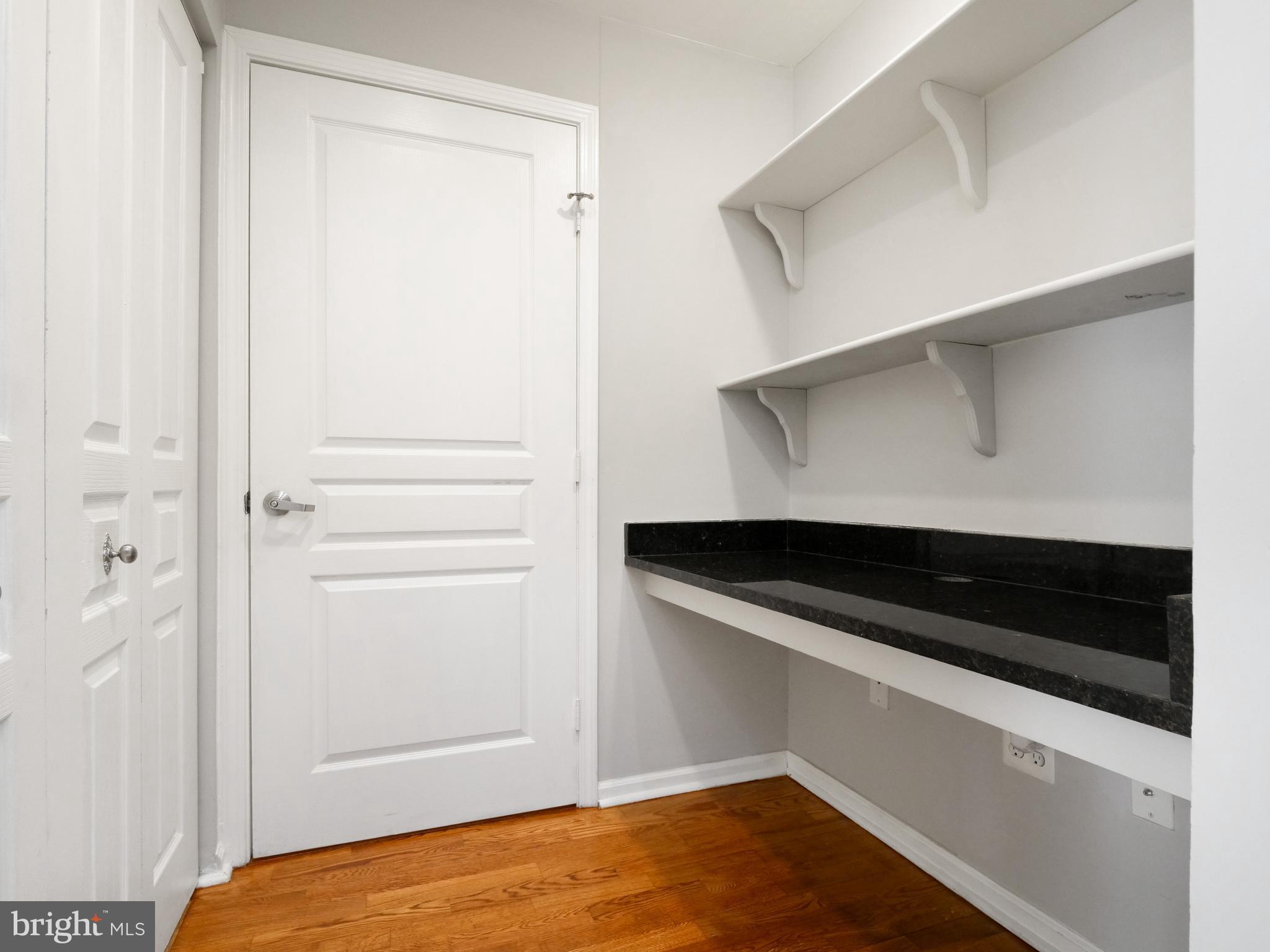 12000 Market Street, Unit 419 Reston, VA 20190 - Photo 15 of 31 Office nook and full size washer/dryer in closet