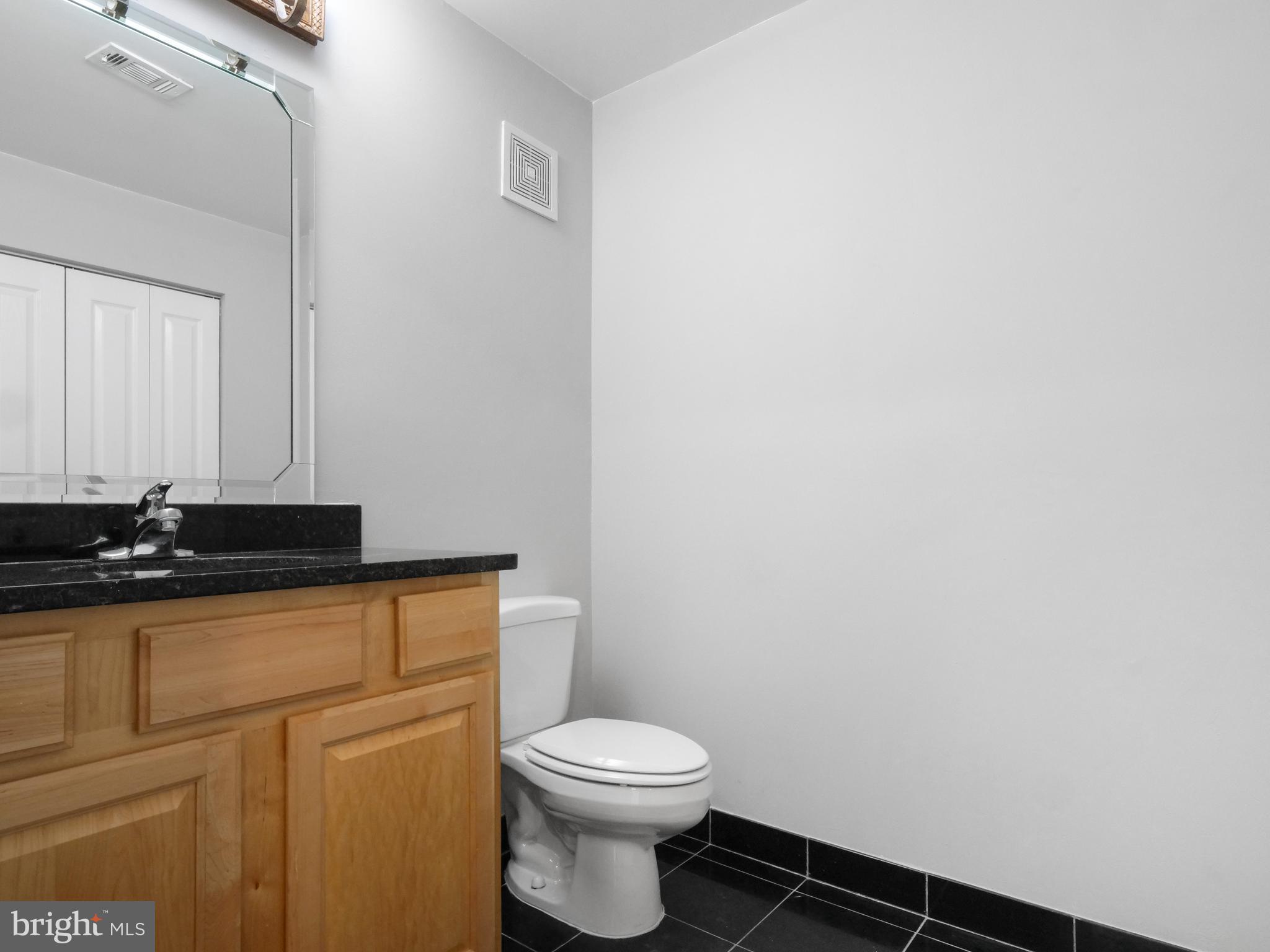 12000 Market Street, Unit 419 Reston, VA 20190 - Photo 16 of 31 Large half bath and storage closet on first level