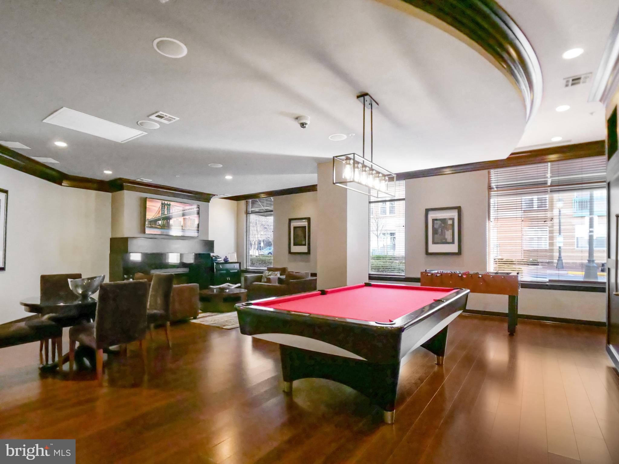12000 Market Street, Unit 419 Reston, VA 20190 - Photo 21 of 31 Game room with billiards and fussball