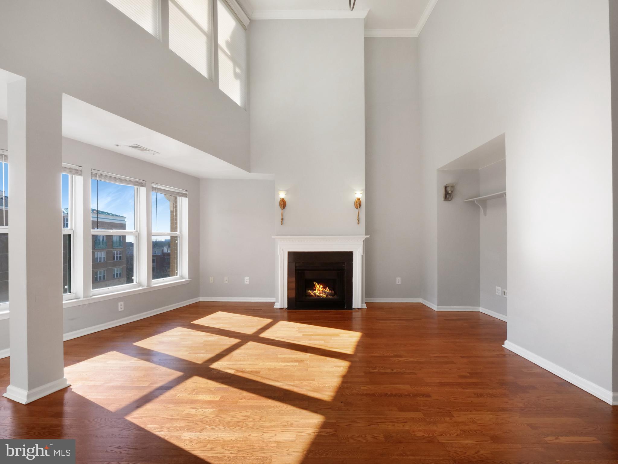 12000 Market Street, Unit 419 Reston, VA 20190 - Photo 4 of 31 A flood of light from the wall of windows