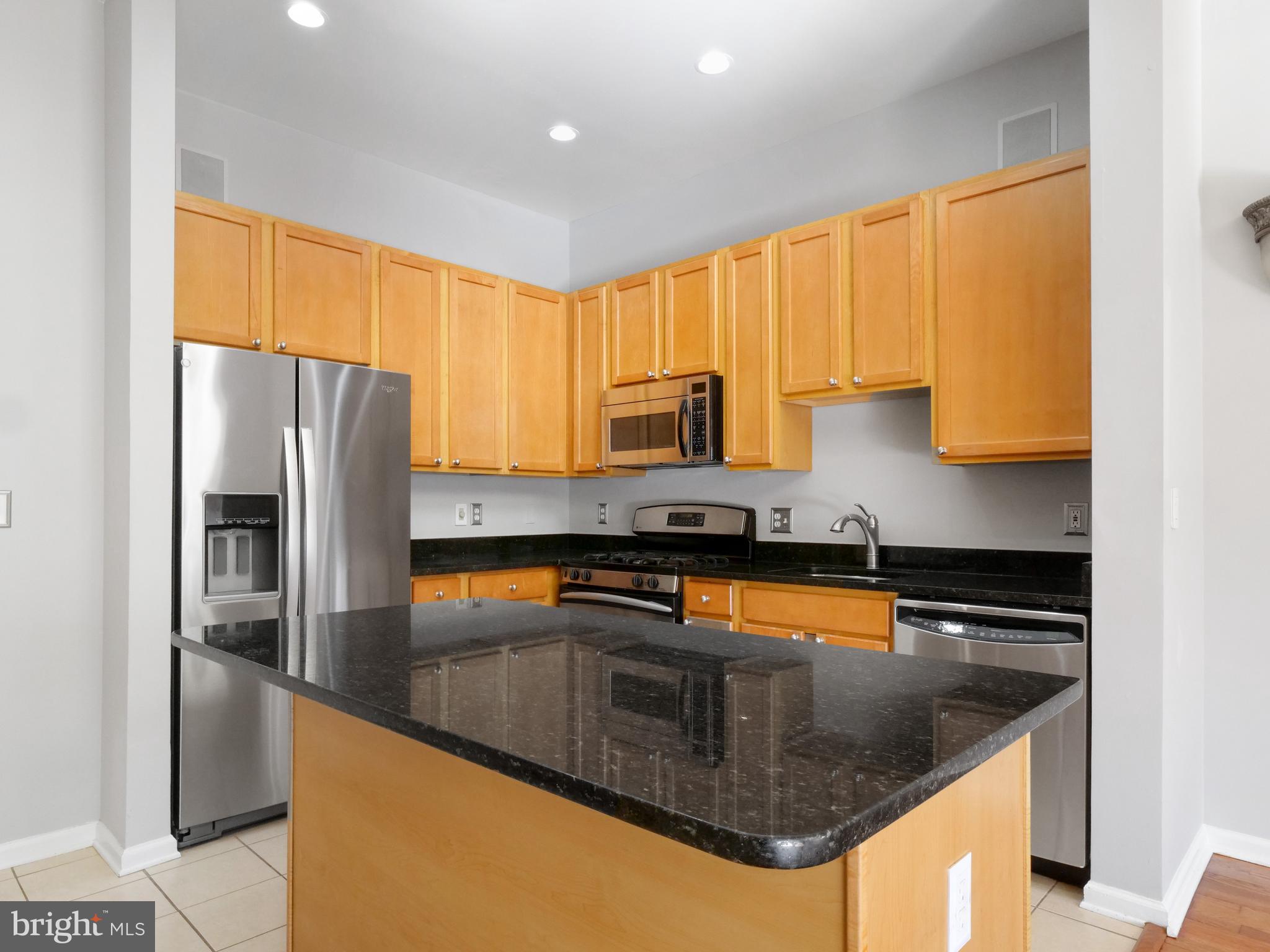 12000 Market Street, Unit 419 Reston, VA 20190 - Photo 7 of 31 Stainless steel appliances and granite counters