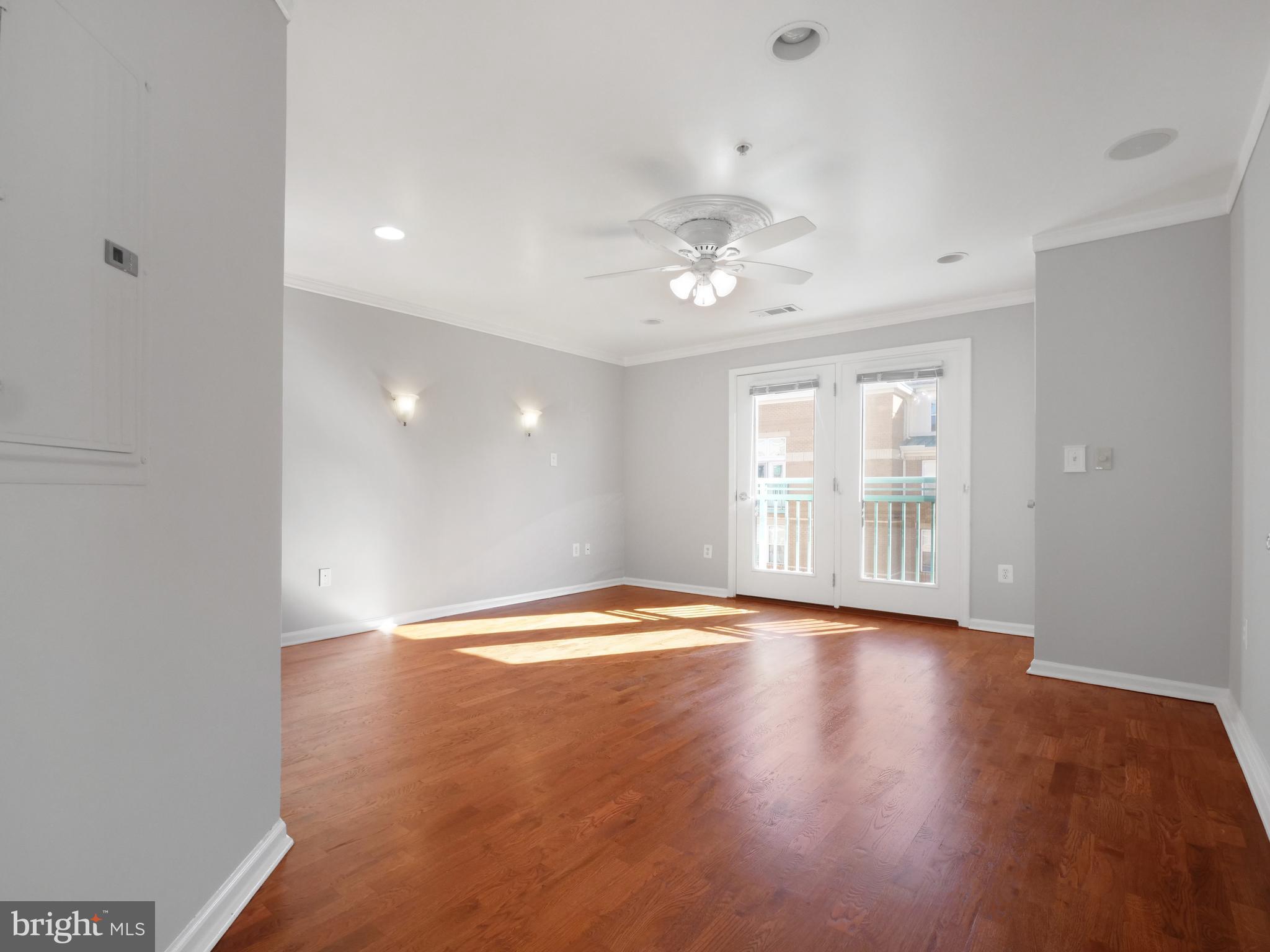 12000 Market Street, Unit 419 Reston, VA 20190 - Photo 8 of 31 Large primary bedroom with Juliette balcony