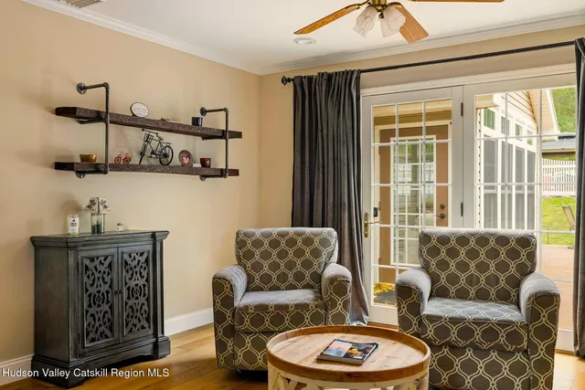 a view of a livingroom with furniture and a flat screen tv