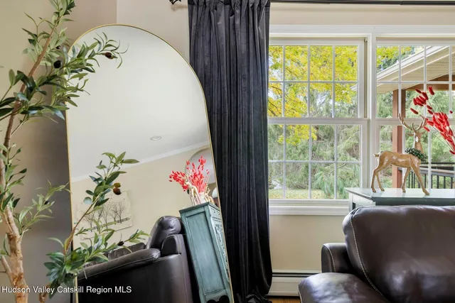 a kitchen with stainless steel appliances granite countertop a stove a sink dishwasher a refrigerator and a dining table with wooden floor