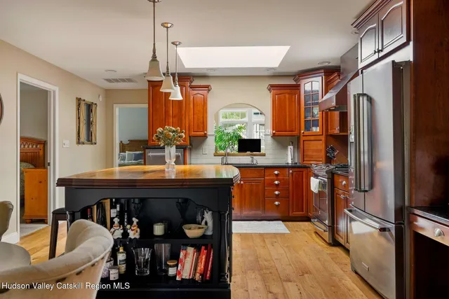 a bedroom with a bed and a dresser in it