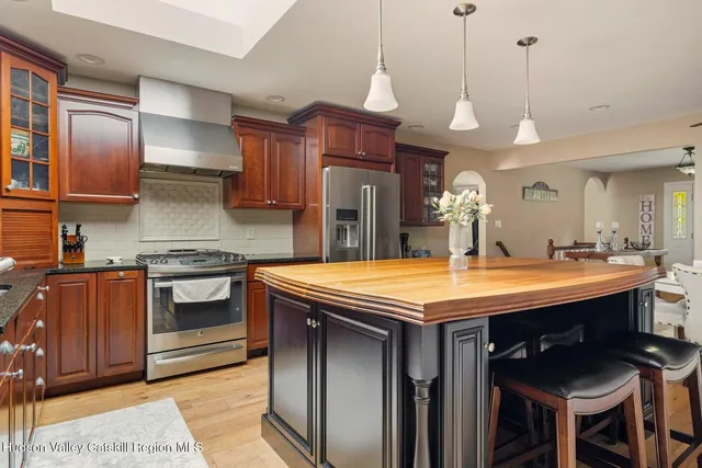 a bedroom with a bed and a television