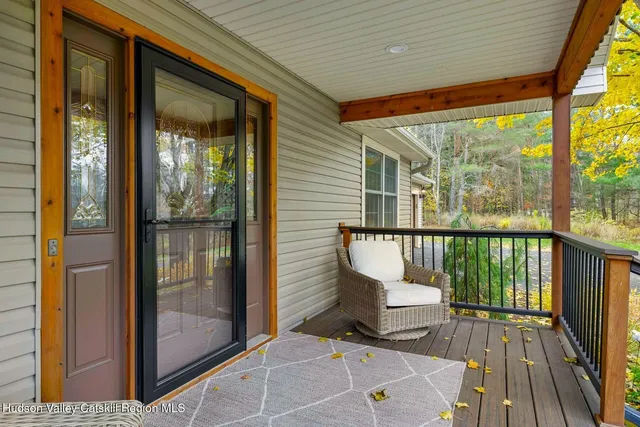a view of a balcony with furniture