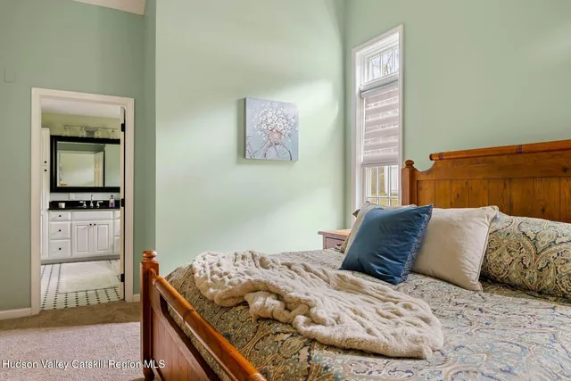 a view of a house with a chairs and table in a patio