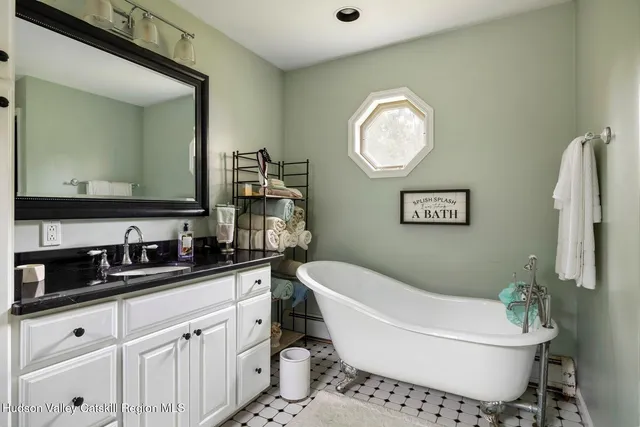 a view of a deck with chairs a barbeque with wooden floor and fence