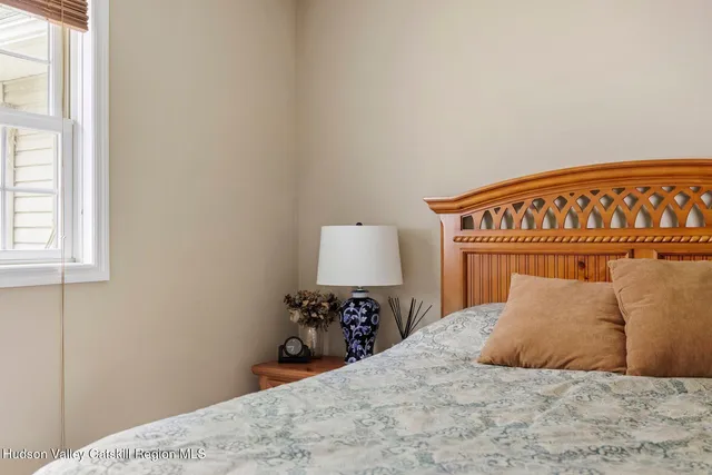 an aerial view of a house with a yard swimming pool and outdoor seating