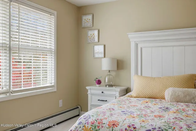 a view of a house with a lush green forest
