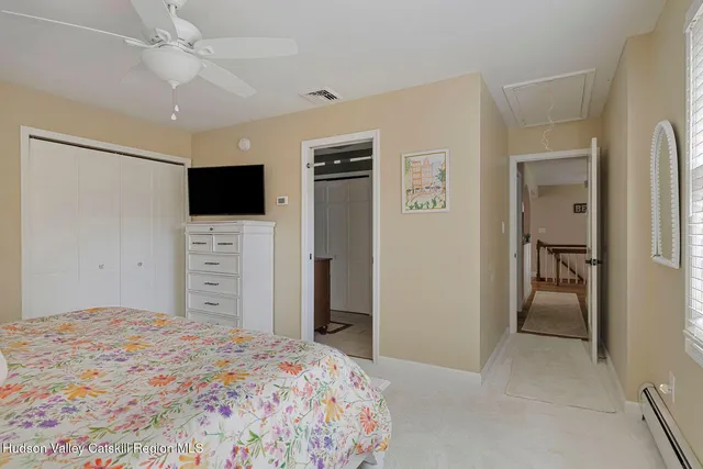 a picture of a room with a white wall and a large window