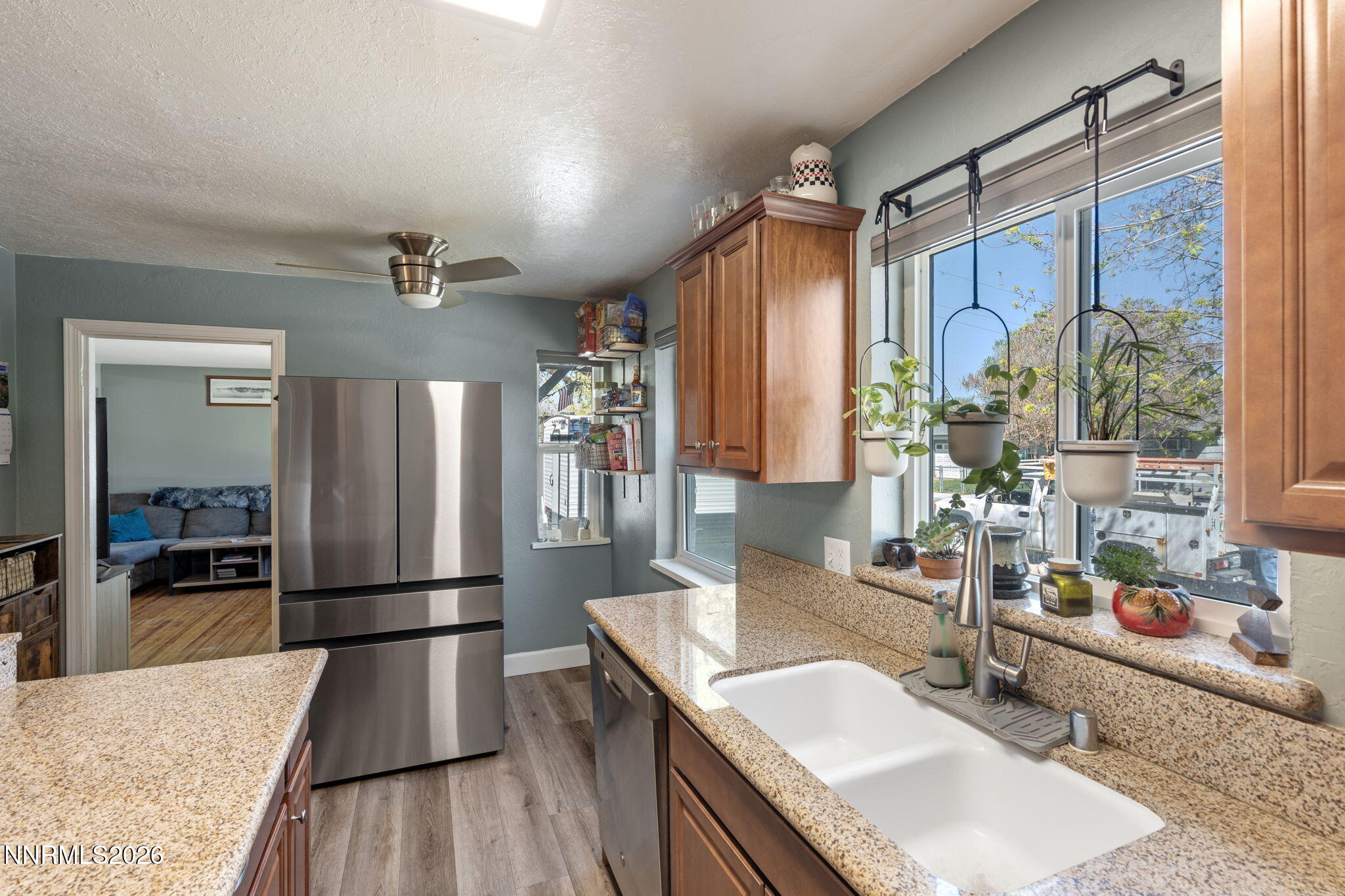 417 H Street Sparks, NV 89431 - Photo 21 of 46 a kitchen with granite countertop a sink appliances and cabinets
