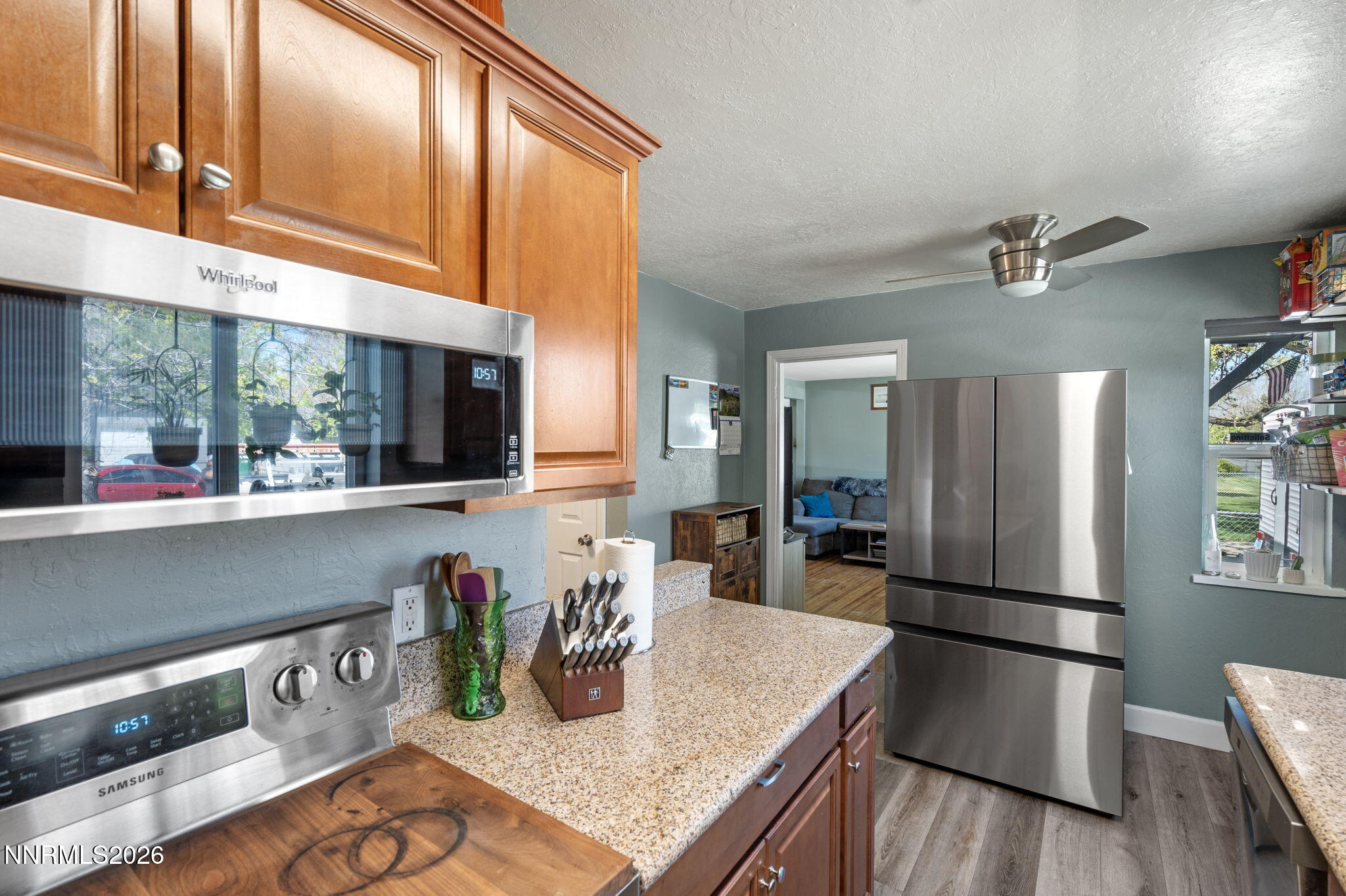 417 H Street Sparks, NV 89431 - Photo 22 of 46 a kitchen with stainless steel appliances granite countertop a refrigerator a sink and a stove
