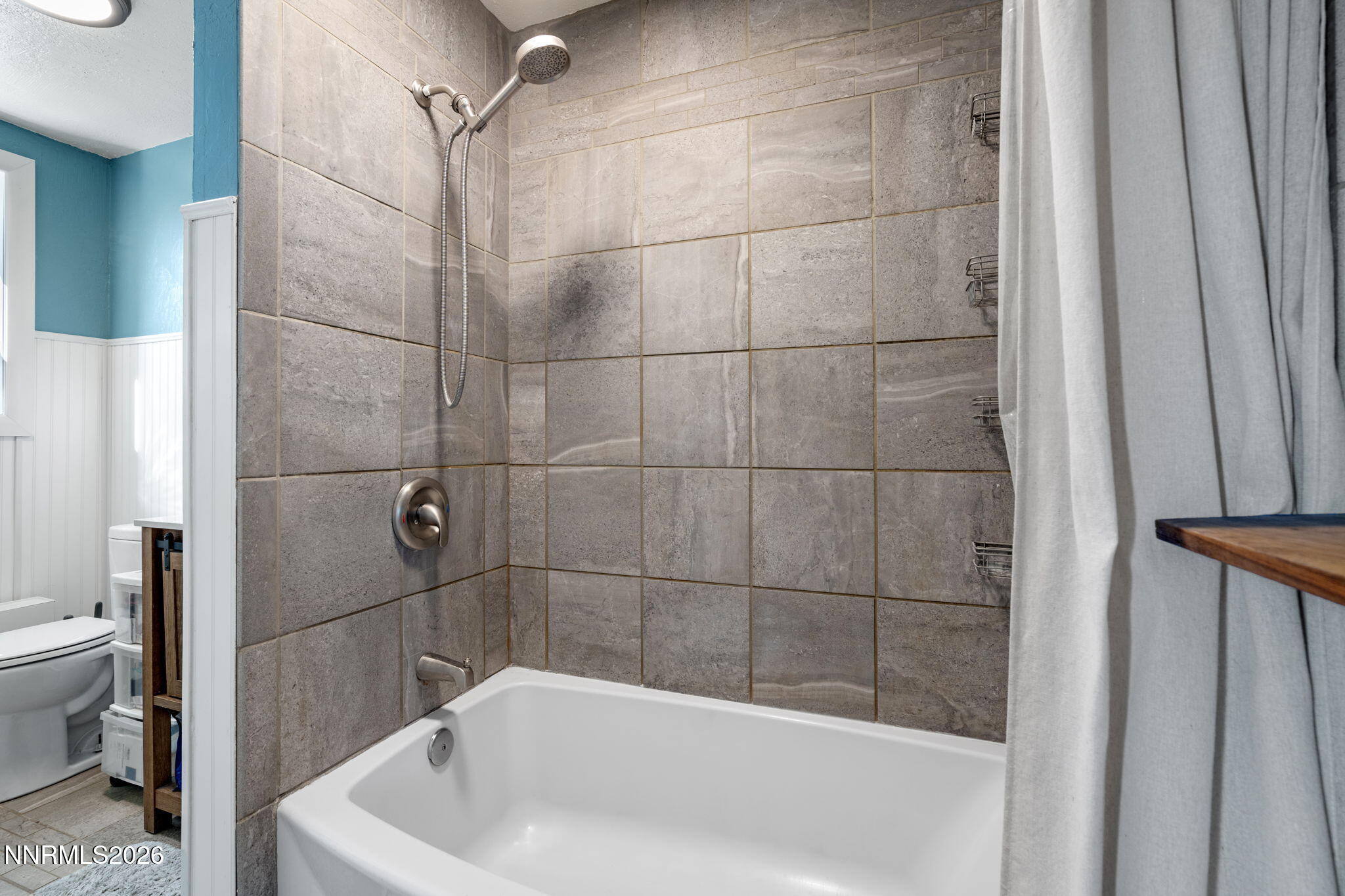 417 H Street Sparks, NV 89431 - Photo 26 of 46 a bathroom with a bathtub and a shower