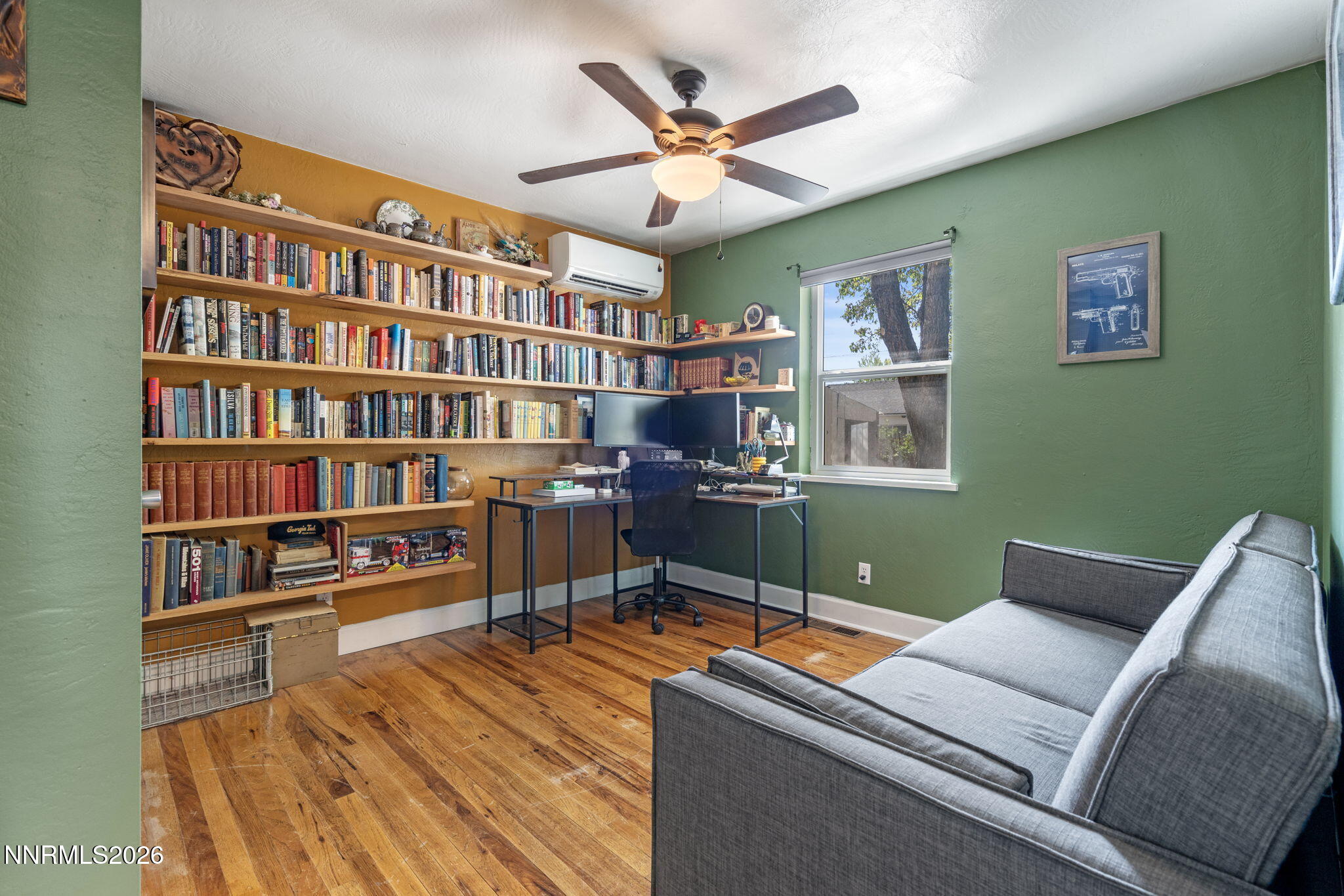417 H Street Sparks, NV 89431 - Photo 27 of 46 a living room with furniture and a book shelf