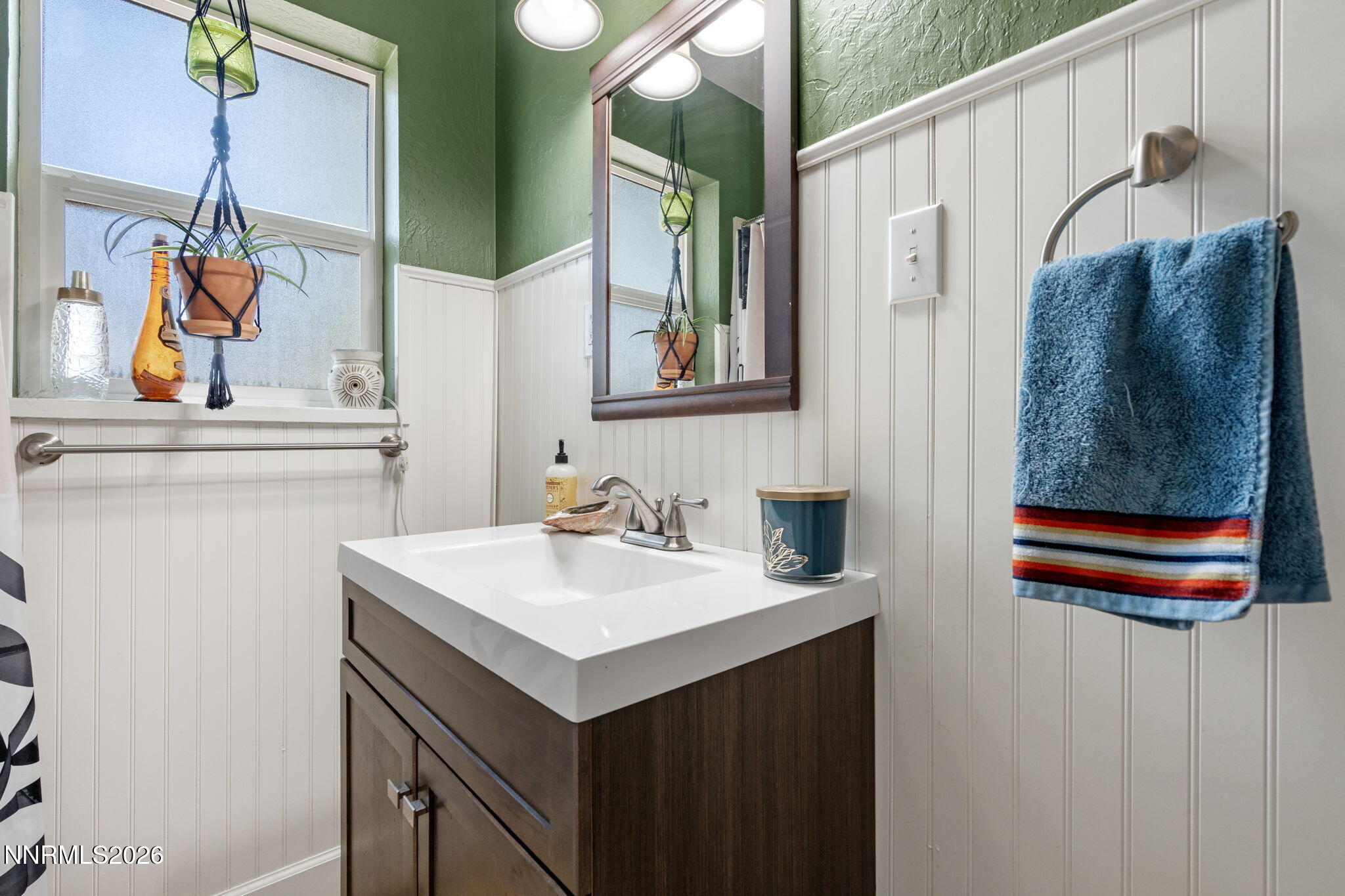 417 H Street Sparks, NV 89431 - Photo 30 of 46 a bathroom with a sink and a mirror