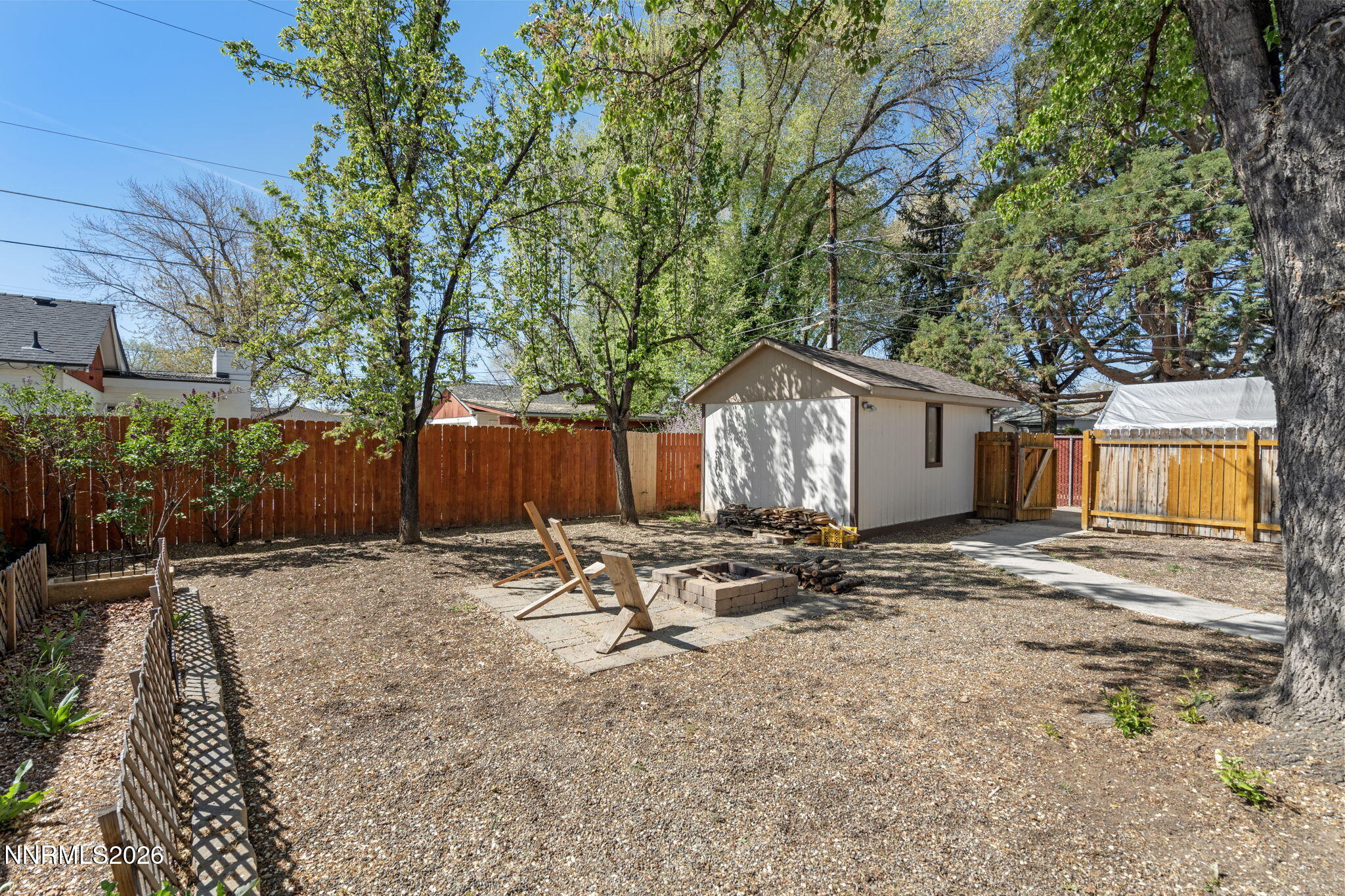 417 H Street Sparks, NV 89431 - Photo 36 of 46 a backyard of a house with table and chairs