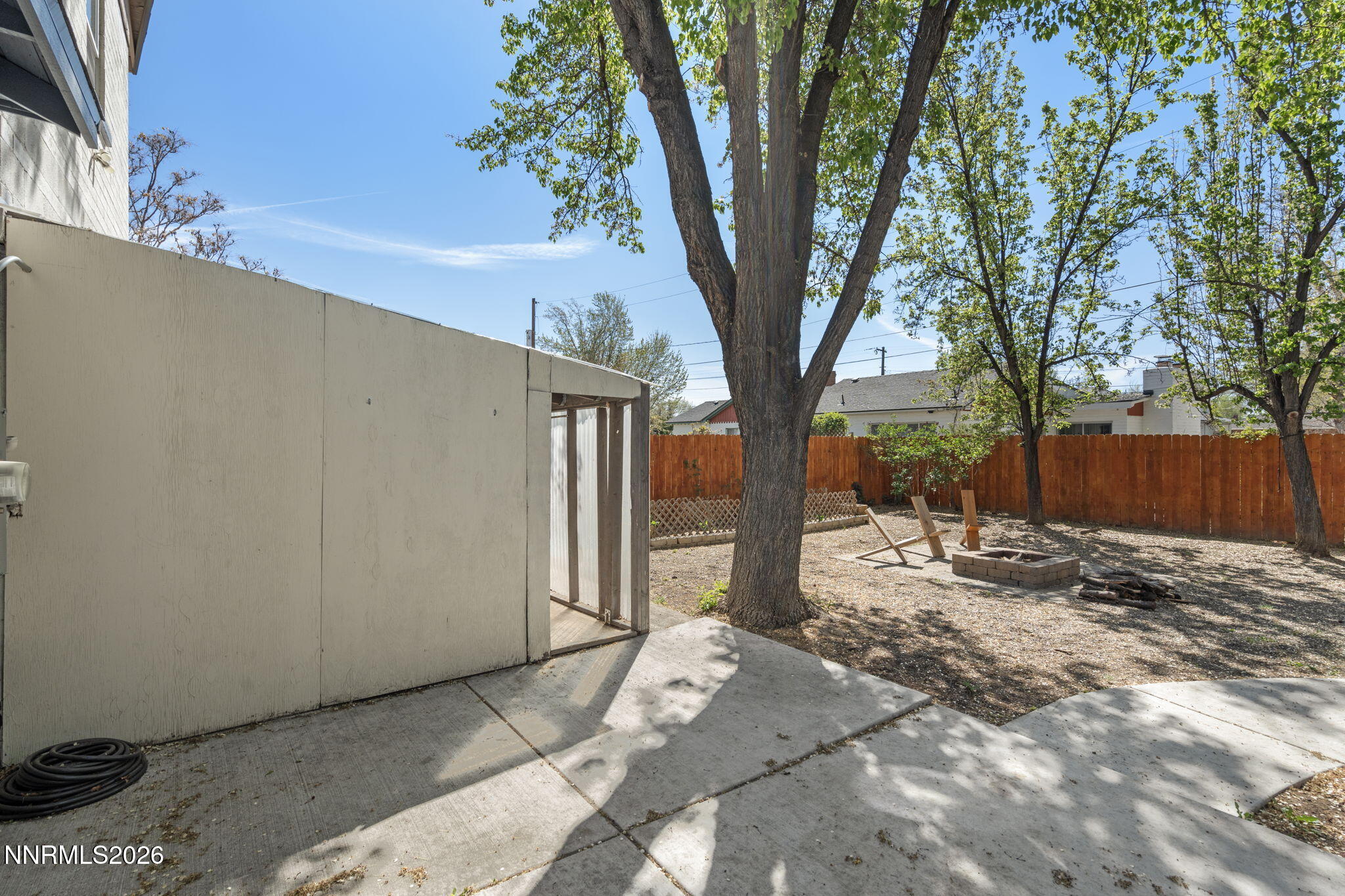 417 H Street Sparks, NV 89431 - Photo 41 of 46 a backyard of a house with large trees
