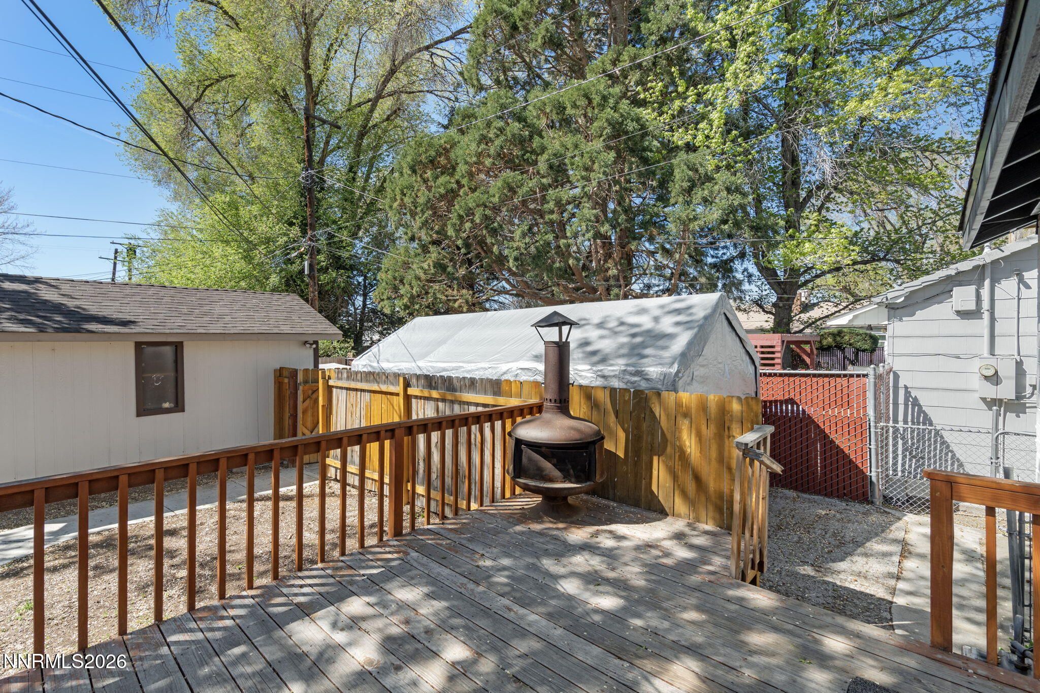 417 H Street Sparks, NV 89431 - Photo 42 of 46 a view of a roof deck with wooden fence and a couple of chairs