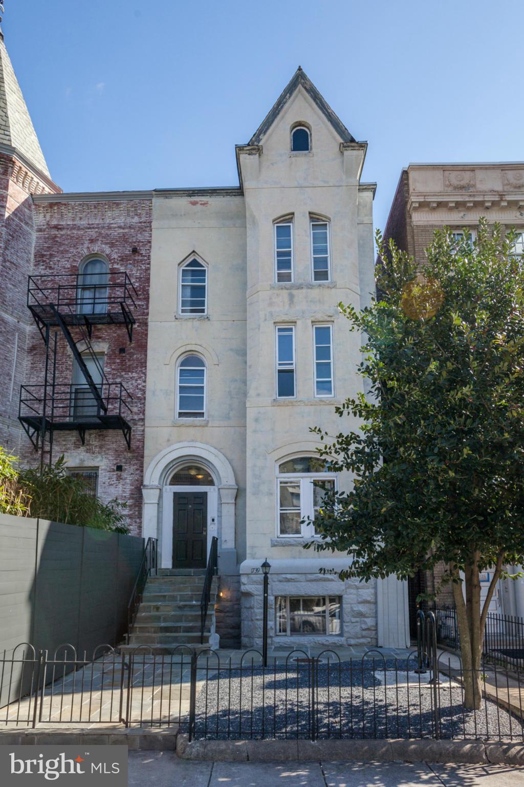 1739 19th Street Northwest Washington, DC 20009 - Photo 1 of 20 a front view of a house with a yard