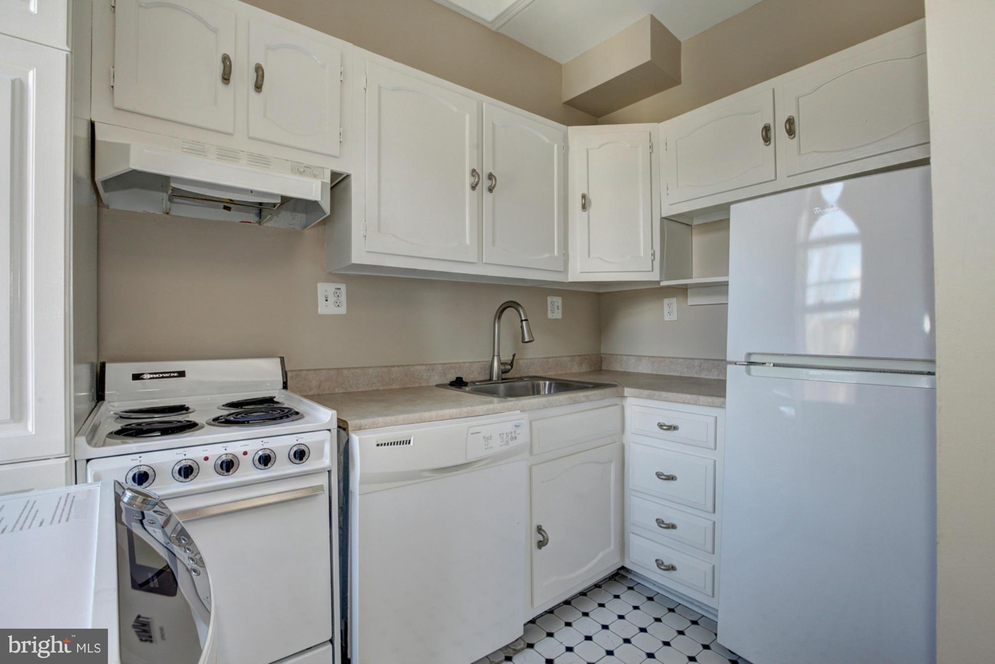 1739 19th Street Northwest Washington, DC 20009 - Photo 13 of 20 a kitchen with appliances a sink and cabinets