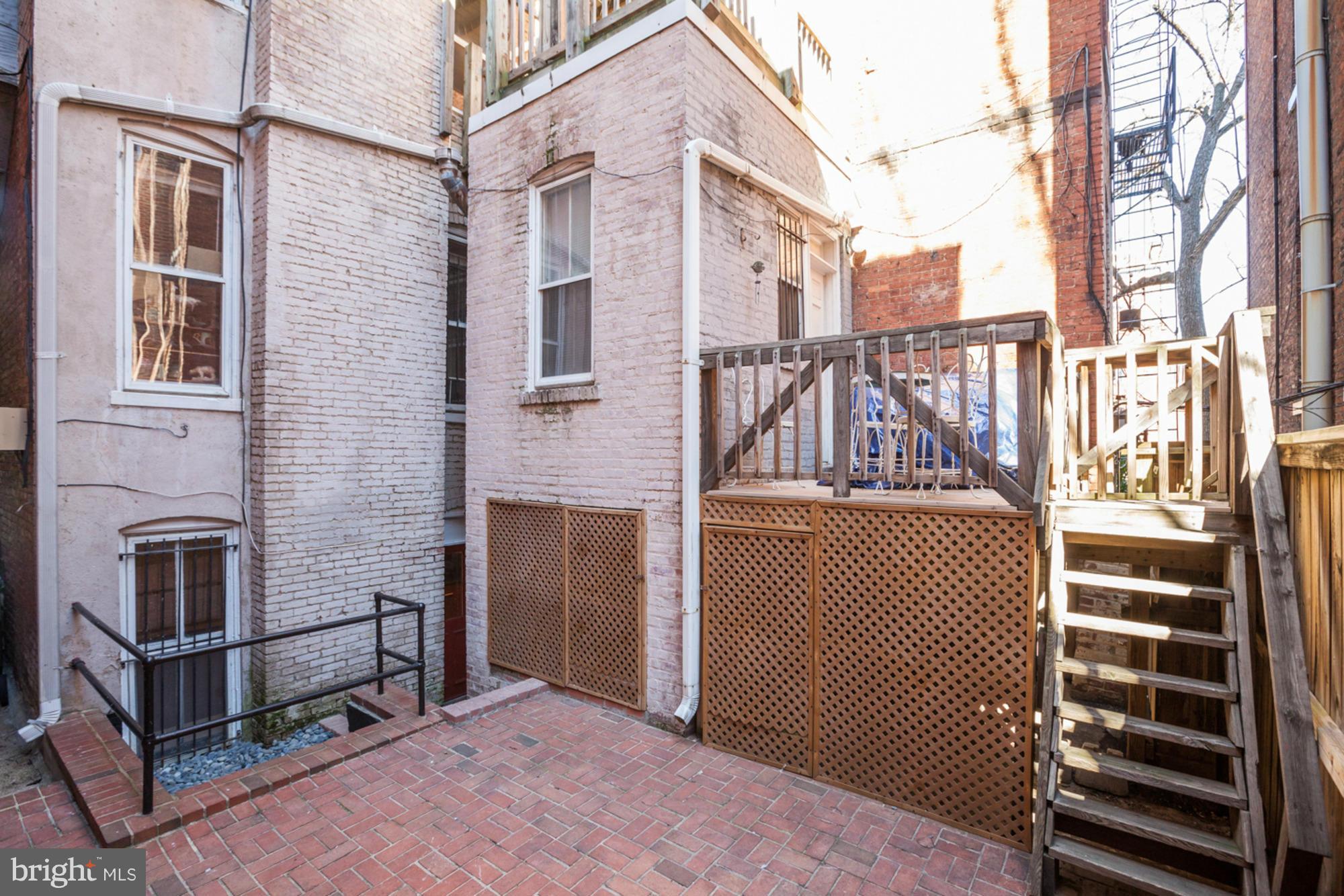 1739 19th Street Northwest Washington, DC 20009 - Photo 19 of 20 a view of a brick house with iron stairs