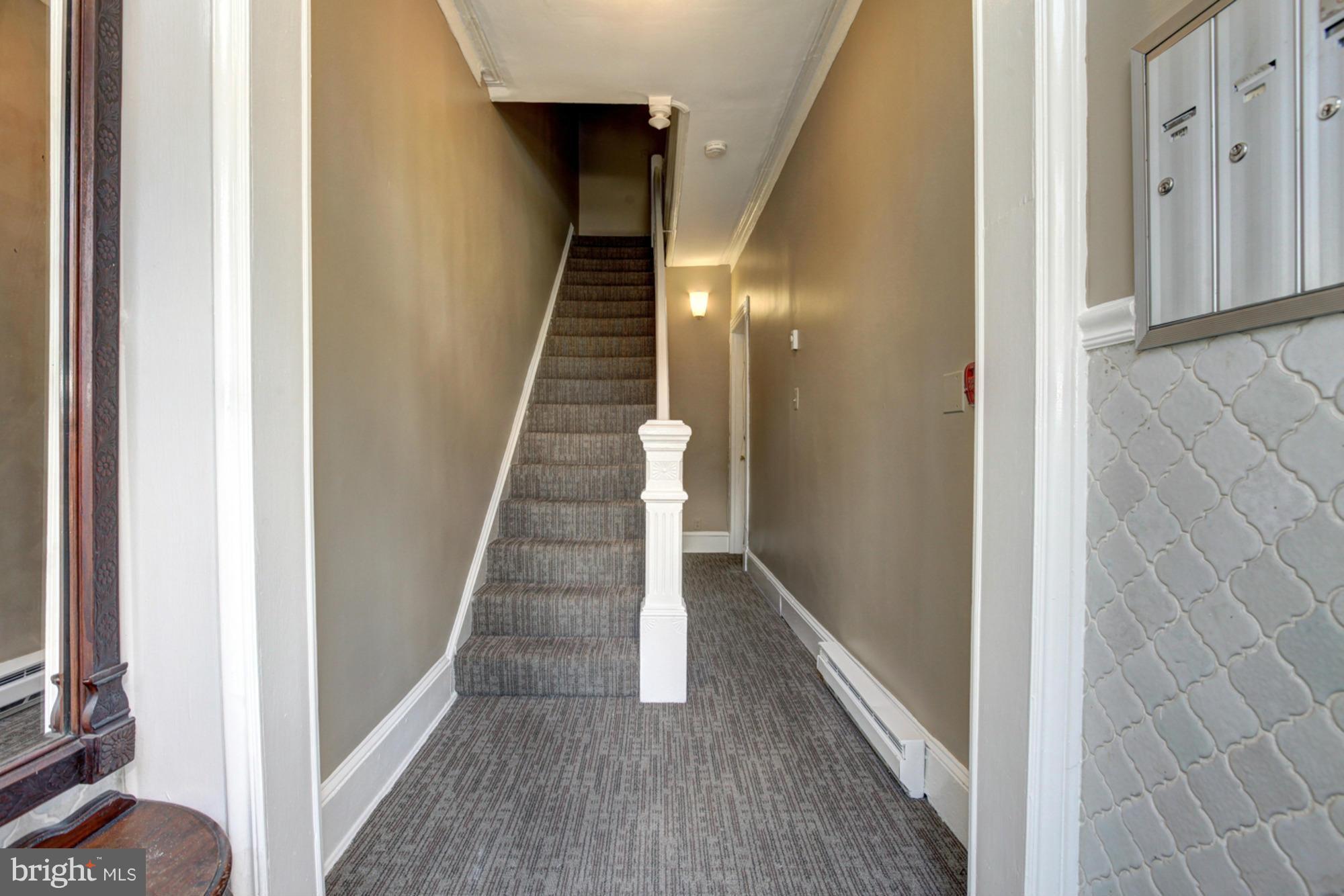 1739 19th Street Northwest Washington, DC 20009 - Photo 3 of 20 a view of a hallway with wooden floor and staircase