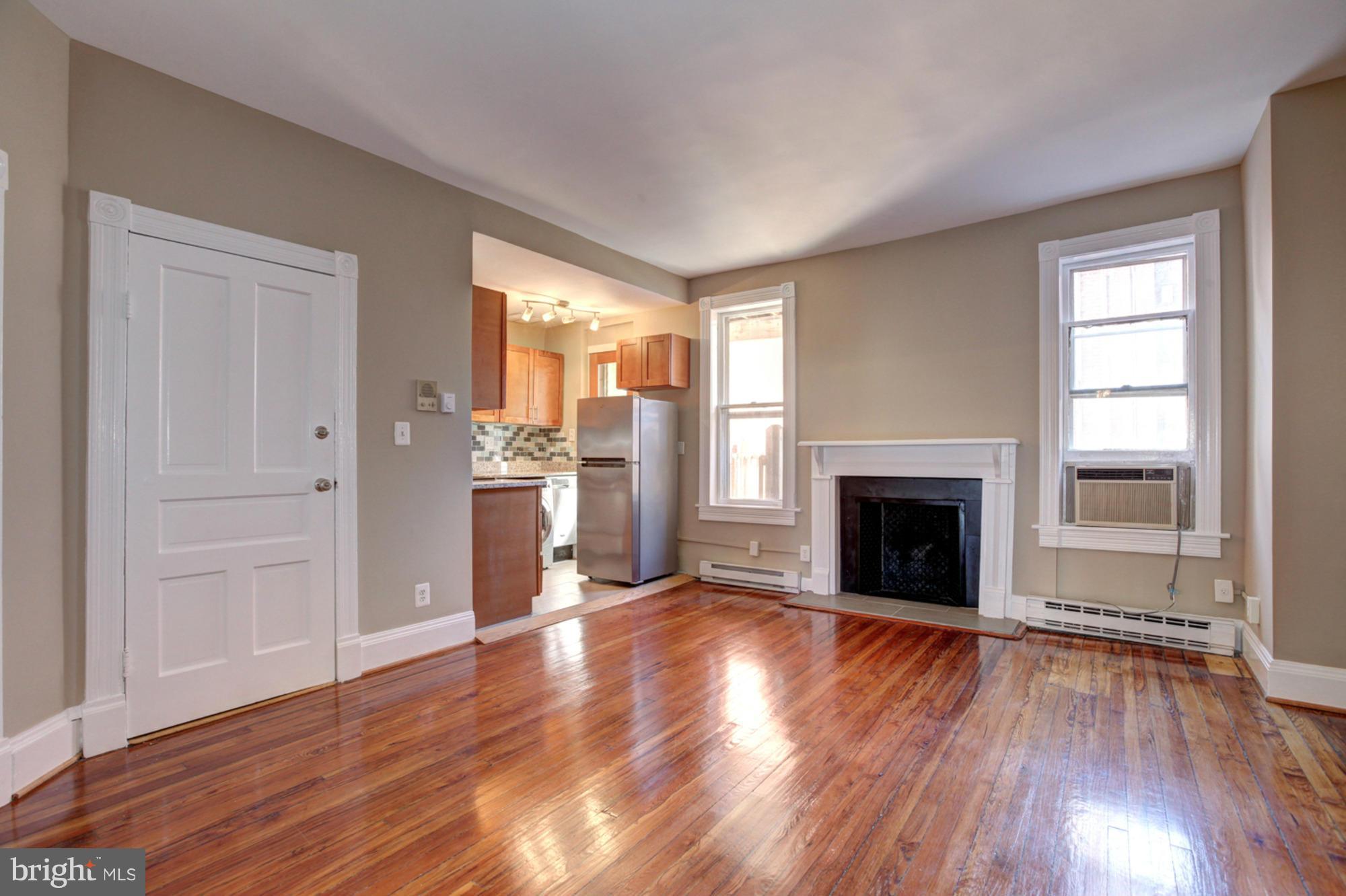 1739 19th Street Northwest Washington, DC 20009 - Photo 4 of 20 wooden floor fireplace and windows in an empty room