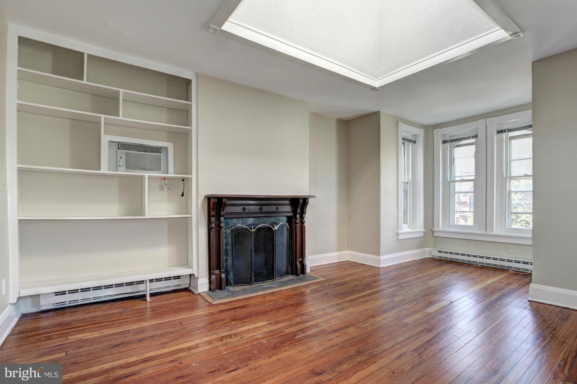 1739 19th Street Northwest Washington, DC 20009 - Photo 7 of 20 a view of an empty room with glass door and a window