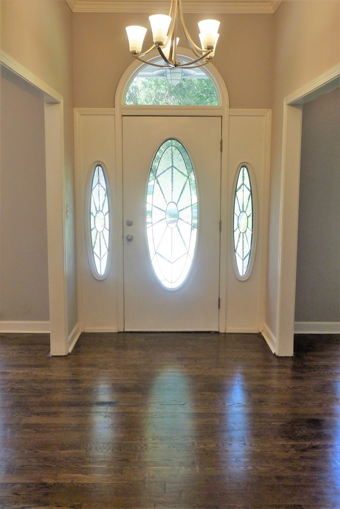 316 Lower Simmons Road Macon, GA 31220 - Photo 2 of 34 an empty room with wooden floor and windows