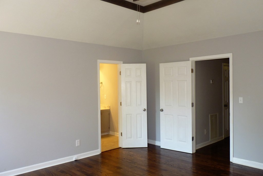 316 Lower Simmons Road Macon, GA 31220 - Photo 12 of 34 an empty room with wooden floor and door