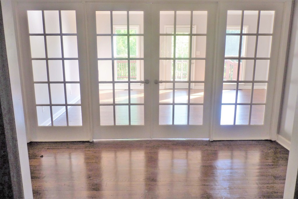 316 Lower Simmons Road Macon, GA 31220 - Photo 16 of 34 a view of an empty room with wooden floor and a window
